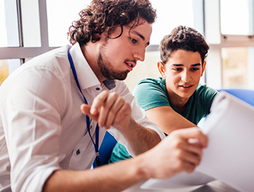 Immigration consultant reviewing application documents with a client